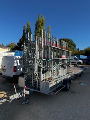 an image of a trailer with a bunch of pipes attached to it