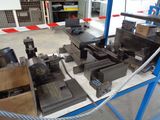 a lot of machinery that is on display in a warehouse