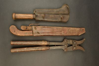 three old tools are sitting on a table next to each other