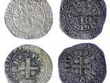 four silver coins with a cross on the front and a cross on the back