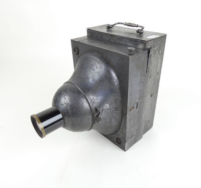 a close up of a metal object on a white surface