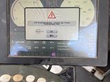 a picture of a computer screen with a warning sign on it