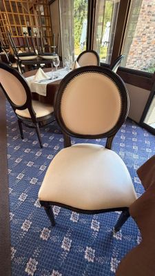 a dining room with a table and chairs in it
