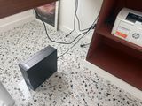an image of a black and white microwave on the floor