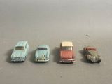 several toy cars are lined up in a row on a table
