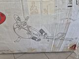 a cardboard box with a drawing of a robot on it