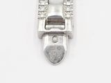 a close up of a silver buckle on a white surface
