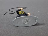 a lego man riding a skateboard with a smile on his face