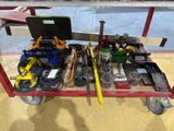 a cart with tools and tools on it in a garage
