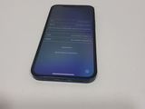 a close up of a cell phone sitting on top of a table