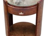 a round table with a glass top and a wooden base