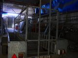 an image of a warehouse with a lot of equipment in it