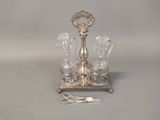 a silver plate with a pair of glasses and a pair of scissors on it