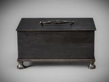 a black wooden box with a fish on top of it
