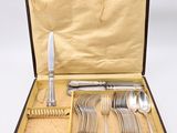 a case with silverware in it on a white surface