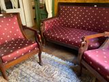 two chairs and a couch in a living room
