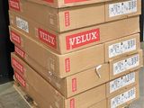 several boxes of veluxx are stacked on a pallet in a warehouse