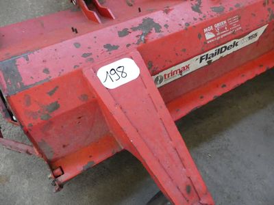 a red machine that is sitting on the ground