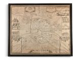 une vieille carte de la ville de Boston, encadrée de noir, accrochée sur un mur blanc