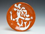 a plate with a picture of a man and a woman on it