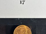 a gold coin with a picture of a woman on it