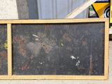 a picture of a picture of a blackboard on the ground