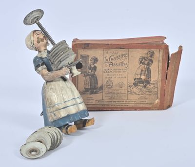 a small toy that is sitting next to a box