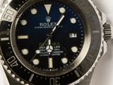 a rolex watch with a blue dial on a bracelet
