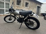 a motorcycle that is parked in front of a building
