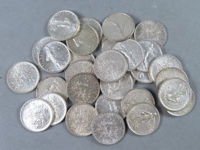 a pile of silver coins sitting on a table