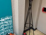 an image of a coat rack with a record on top of it