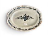 a white plate with a black and white design on it