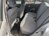 two seats in the back of a car that is empty