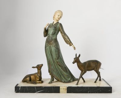 statue of a woman with a deer and a deer on a marble base