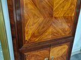 a cabinet that has a door on top of it