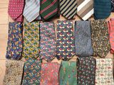 many ties laid out on the floor together