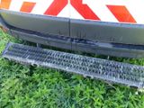 a close up of a metal grate on the side of a vehicle