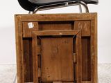 a black chair sitting on top of a wooden box