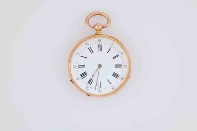 a gold pocket watch with roman numerals on the face