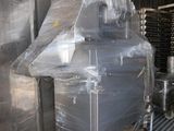 a large machine that is sitting on a pallet in a warehouse