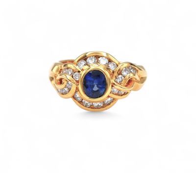 a gold ring with a blue sapphire and diamonds
