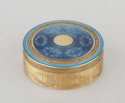 an image of a gold and blue box sitting on top of a white table