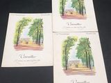 three postcards depicting a view of a park with trees and a bench
