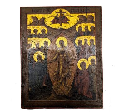 une vieille photo représentant un tableau où l'on voit un homme tenant une croix