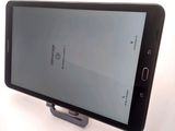 a cell phone that is sitting on top of a stand