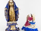 two figurines of the virgin mary and jesus in blue and gold