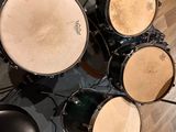 a drum set up on the floor in a room