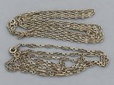 a pair of antique silver chain bracelets