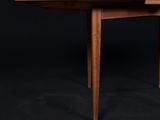 the table is made out of solid wood and has two leaves on the top