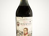 an image of a bottle of wine with a picture of a man on it